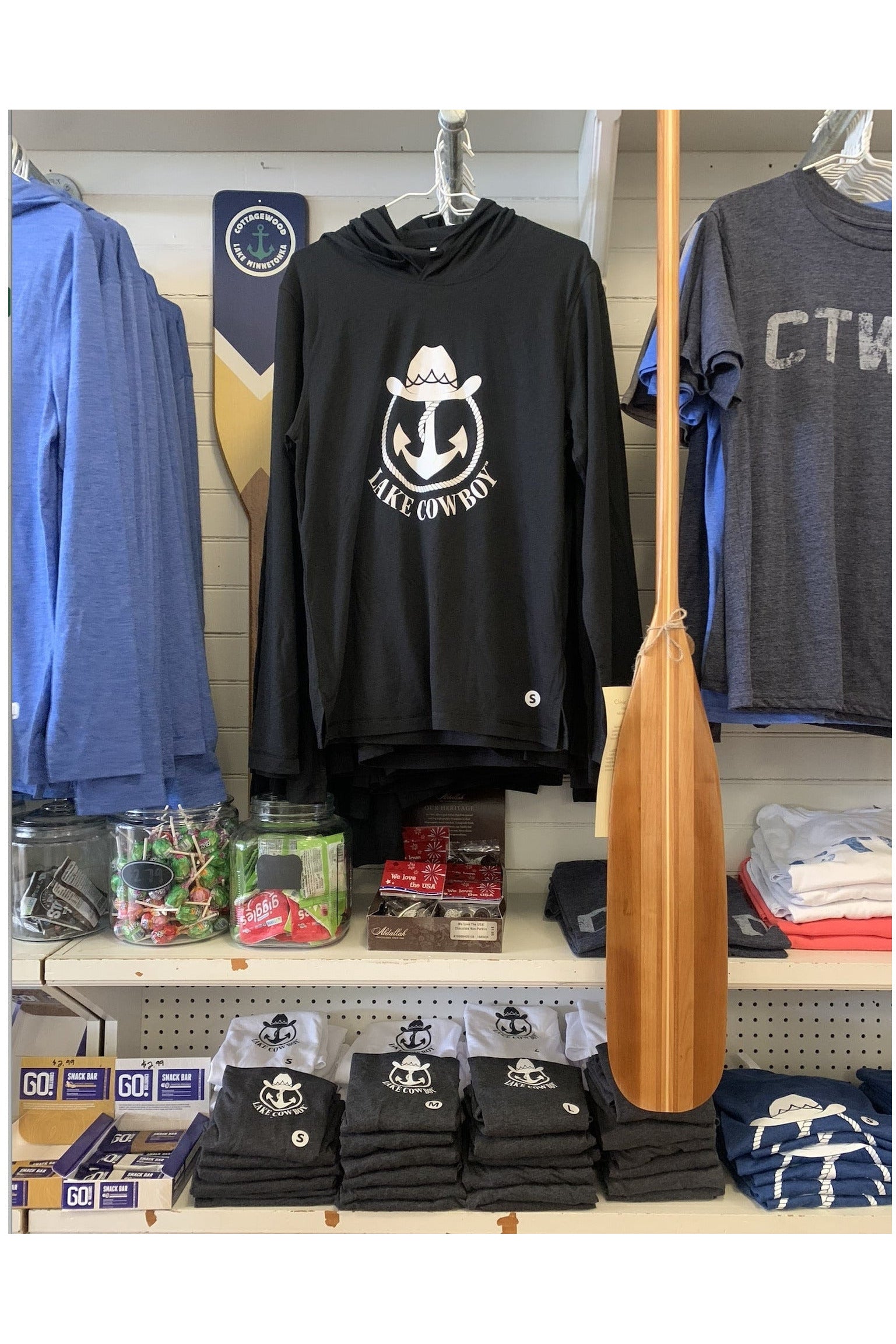 Photo of Lake Cowboy Long Sleeve Hoodie (Black) on display at the Cottagewood General Store in Deephaven, MN