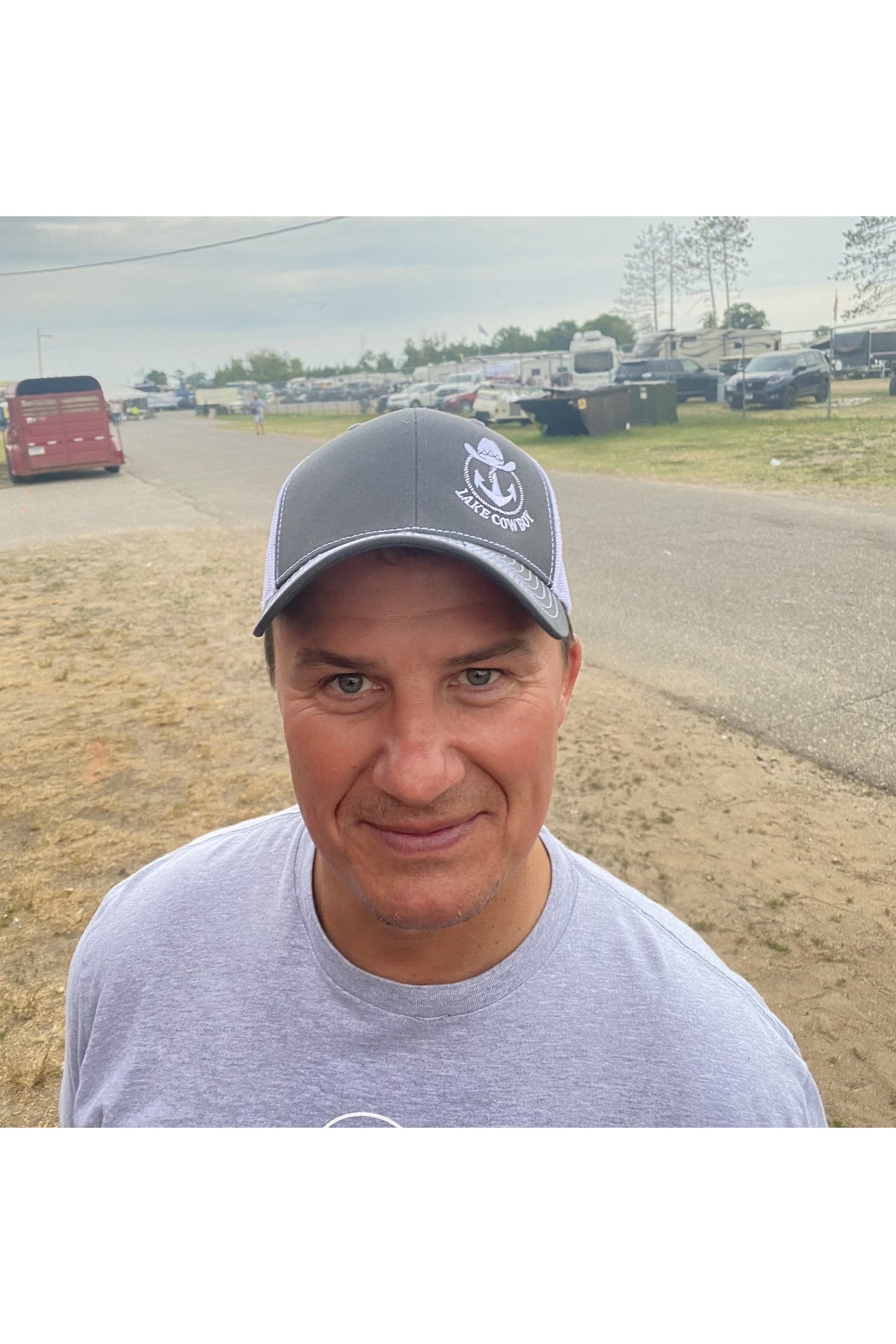 Photo of a man wearing a Lake Cowboy Baseball Hat (Gray & White) at Lakes Jam in Brainerd, MN