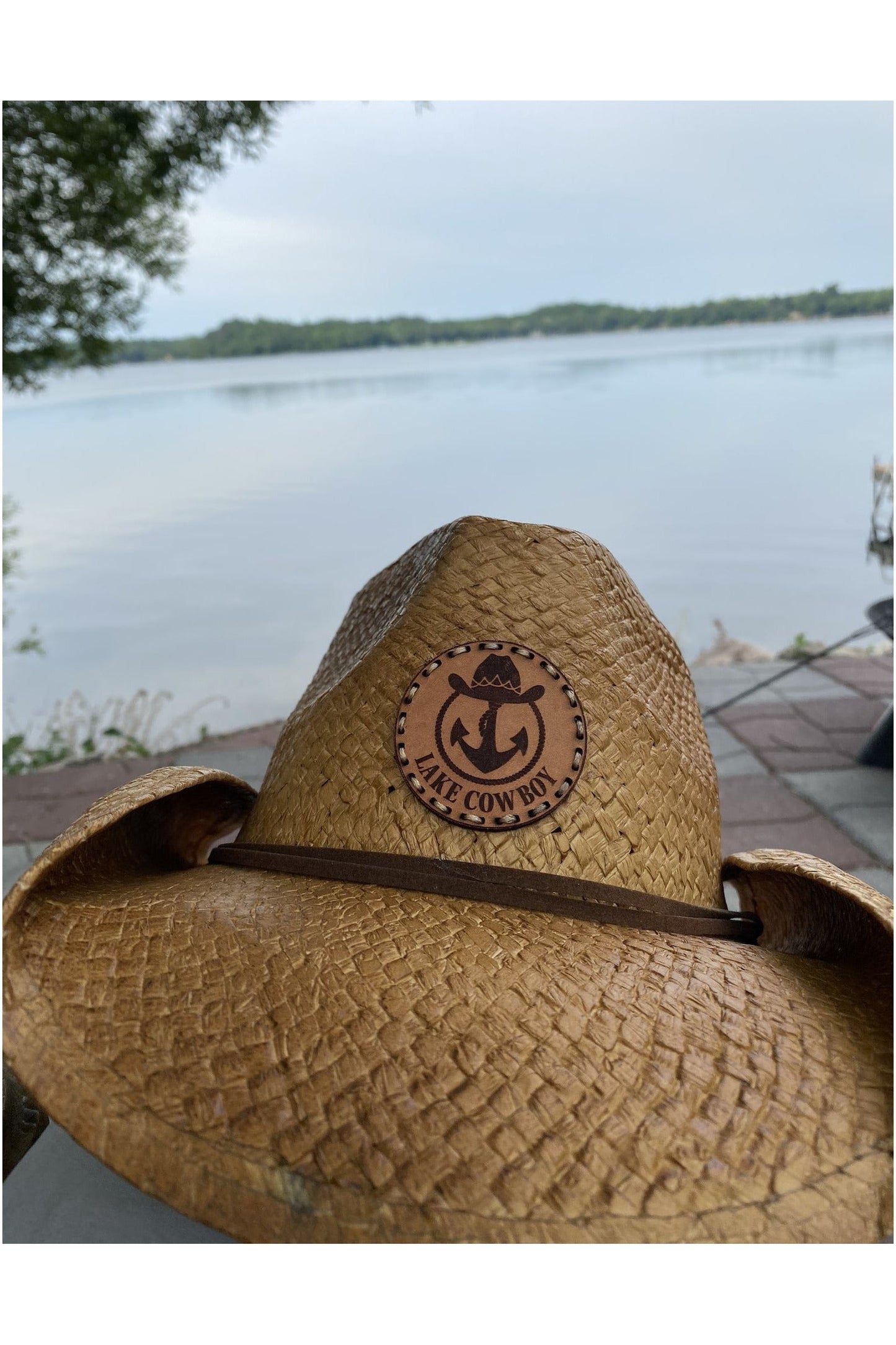 Closeup photo of a Lake Cowboy Signature Cowboy Hat on a patio on Gull Lake in Brainerd, MN