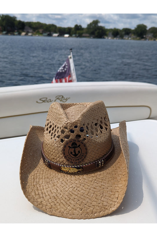 Photo of the Lake Cowgirl Signature Cowboy Hat with Feather Band (Tea Colored) – Photo taken on a boat on Lake Minnetonka.